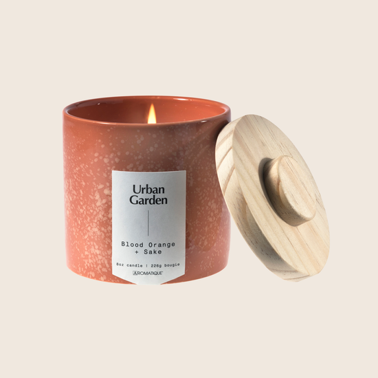 Load image into Gallery viewer, Blood Orange &amp;amp; Sake fills your space with tart blood orange and grapefruit topped with refreshing sake and undertones of green tea leaves. Using coconut blend wax and cotton core wicks encompasses the natural elements that the Urban Gardener values. The speckled ceramic candle is a unique, yet neutral vessel and allows this candle to be used anywhere. Blood Orange &amp;amp; Sake is the perfect everyday staple to bring outdoor inspirations inside. 
